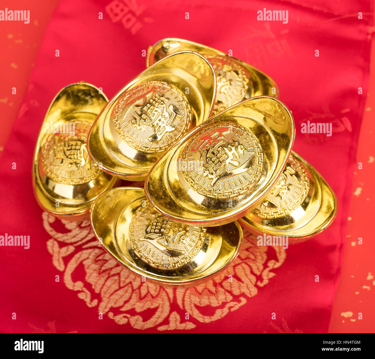 All About Chinese Gold Ingot Meaning: Learn How This Shape Became a Good Fortune Sign. 1 All About Chinese Gold Ingot Meaning: Learn How This Shape Became a Good Fortune Sign.